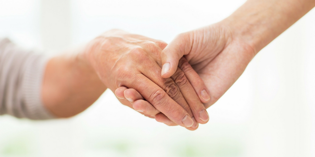 holding hands with elderly